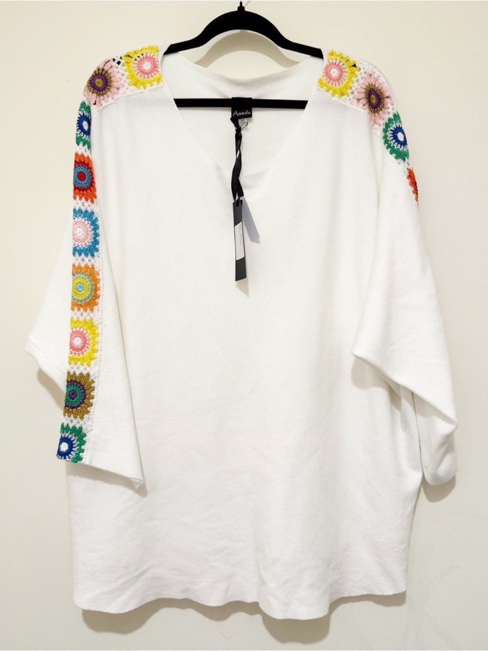 Aaeda White V‑Neck Sweater with Multicolor Crochet Shoulder Detail